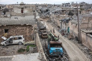 FILE - In this In this Friday, Jan. 30, 2015 file photo, rubble and damaged buildings are seen in the devastated Syrian city of Kobani. While Islamic State fighters have been forced to retreat from Kobani, the strategic town on Syriaís border with Turkey, they appear far from beaten in northern Iraq. Along the Kurdsí shifting front lines, itís a tenuous hold. Whichever side triumphs will determine whether Islamic State can use the main highway west to funnel weapons and reinforcements to their retreating comrades in Syria. (AP Photo, File)